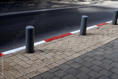 Pillars along the road for the safe passage of pedestrians.