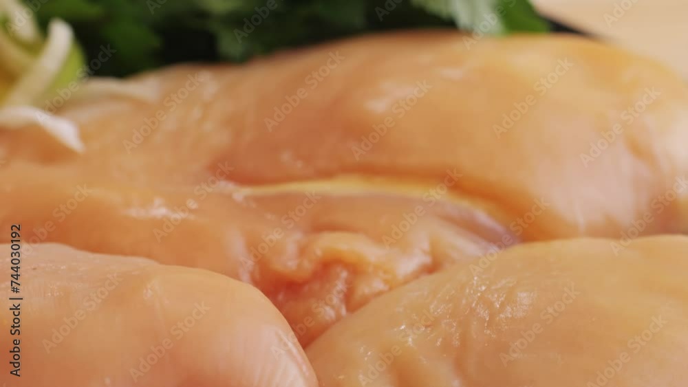 Raw chicken meat on plate close-up. Preparing raw food for cooking. Grilled chicken, duck, turkey kebab with vegetables. Raw chicken meat on plate close-up. Preparing raw food for cooking. Grilled chicken, duck, turkey kebab with vegetables.