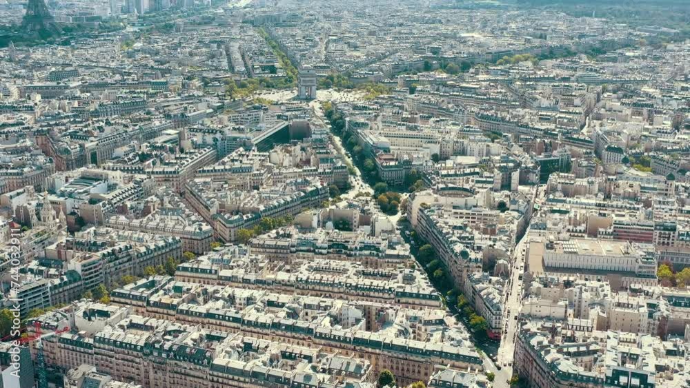 PARIS, FRANCE - MAY 30, 2023: Panorama aerial view of Paris city historical center. Top drone view of old and modern famous touristic landmarks. Colorful sky at at sunny day. PARIS, FRANCE - MAY 30, 2023: Panorama aerial view of Paris city historical center. Top drone view of old and modern famous touristic landmarks. Colorful sky at at sunny day.