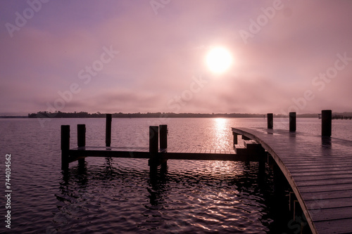 Big sun rising over a lavender morning on the St. Johns River