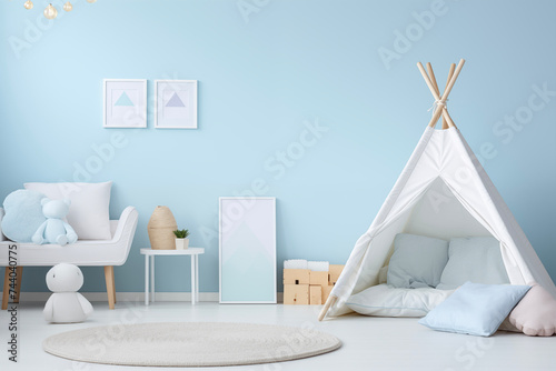Nursery interior. Bed, toys, photo frame backdrop. Boys blue bedroom. Children's Playroom.