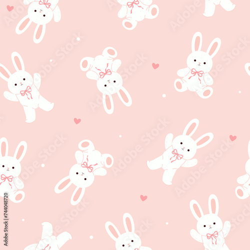 Seamless pattern with cute toy rabbits in soft pink colors. Vector graphics