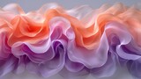  a close up of a pink, purple, and orange ruffle on a gray background with a white background and a gray background with an orange and pink ruffle on the bottom.
