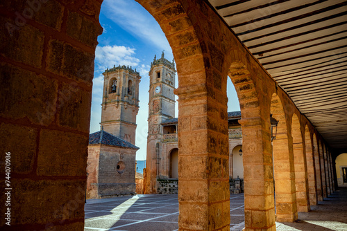 Plaza Monumental with the towers of Tardon and the old convent of Alcaraz, Albacete, Castilla la Mancha, Spain between the arcades of the palaces around photo