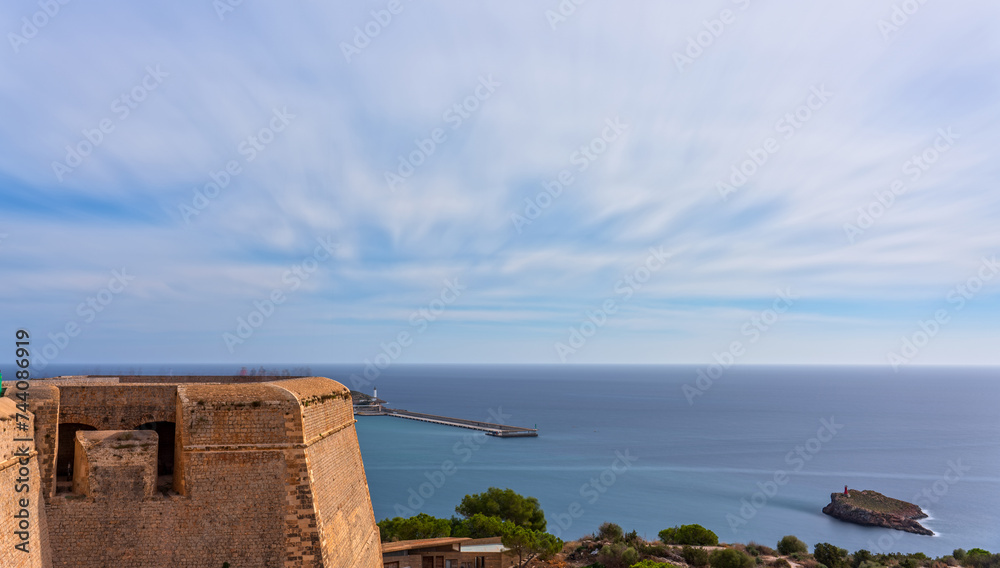 Sun Setting Over Dalt Vila Castle with Vibrant Tourist Trails in Ibiza