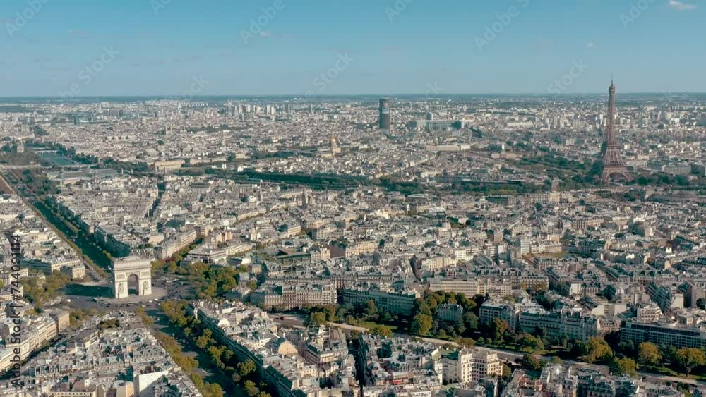 PARIS, FRANCE - MAY 30, 2023: Panorama aerial view of Paris city historical center. Top drone view of old and modern famous touristic landmarks. Colorful sky at at sunny day. PARIS, FRANCE - MAY 30, 2023: Panorama aerial view of Paris city historical center. Top drone view of old and modern famous touristic landmarks. Colorful sky at at sunny day.