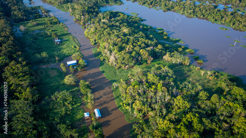 A beautiful aerial view at sunset of a flooded area  igap    during the flooding of the Negro River in the Brazilian Amazon  in the Xiborena community  near the city of Manaus  AM .