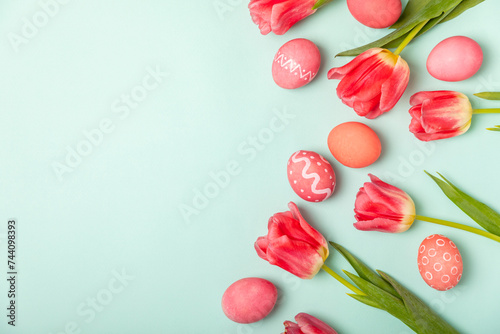 Canvas Print Easter eggs with a bouquet of tulips on a bright turquoise background