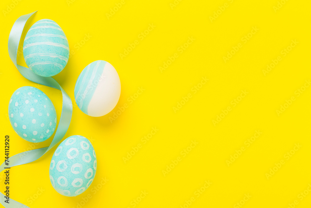 Fototapeta premium Blue easter eggs on color background, top view