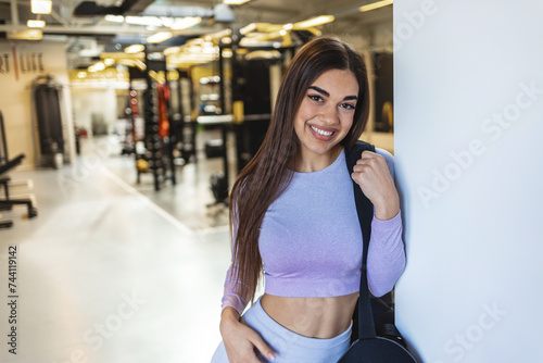 Foto Portrait, fitness and gym with a sports Caucasian woman ready for exercise or training alone in health club