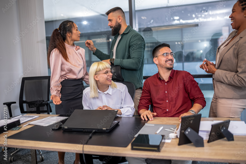 Office colleagues having discussion during meeting in conference room. Group of men and women in modern office. Office colleagues having discussion during meeting in conference room. Group of men and women in modern office.