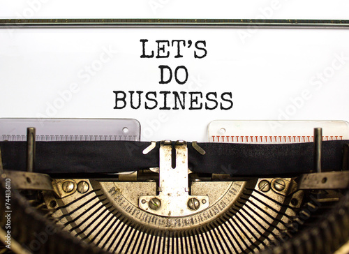let is do business symbol. Concept words let is do business typed on beautiful old retro typewriter. Beautiful white paper background. let is do business concept. Copy space.
