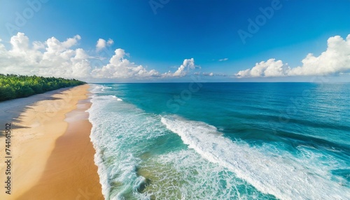 summer seascape beautiful waves blue sea water in sunny day top view from drone sea aerial view amazing tropical nature background inspirational bright sea with waves splash crash and beach sand