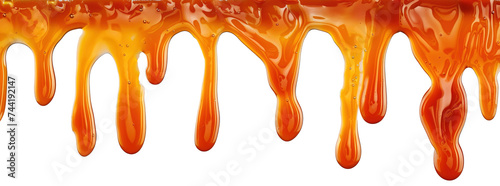 Salted caramel sauce dripping over isolated white transparent background photo