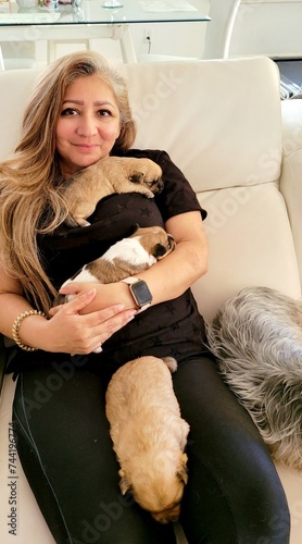 Woman Holding Puppies