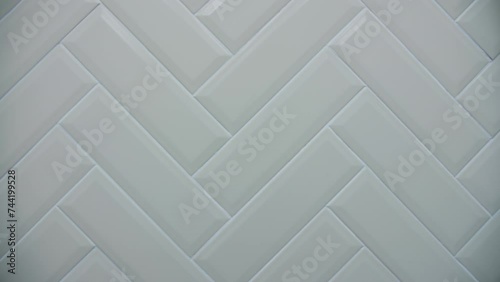 Light ceramic tiles at an angle in the bathroom photo