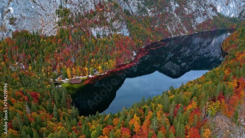 Crystal clear lake Toplitz below mountain cliffs and autumn forests. photo