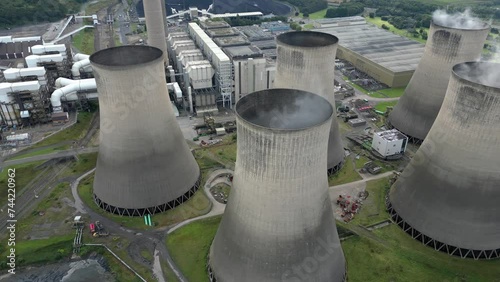 Ratcliffe-on-Soar power station aerial view dolly across smoking coal powered nuclear fired cooling towers photo