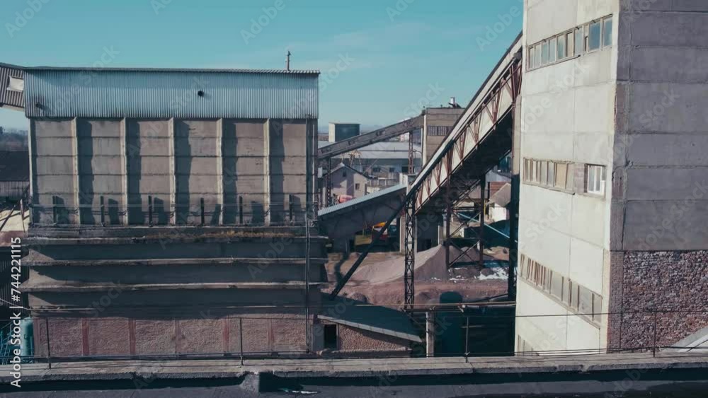 Cement factory at industrial production area. Cement silos and industrial trucks. Manufacture and global industry concept. Cement factory at industrial production area. Cement silos and industrial trucks. Manufacture and global industry concept.