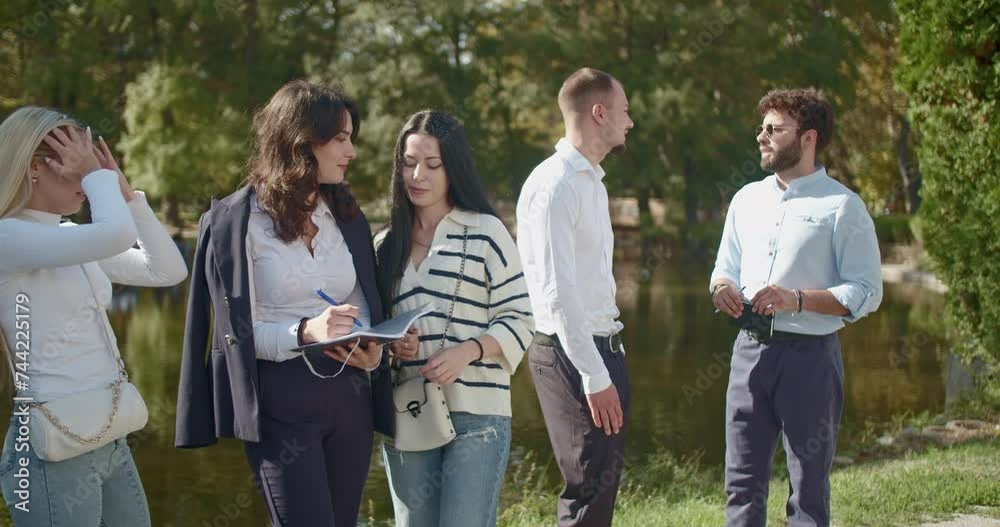 Group of young university students engaging in conversation and study in a picturesque park, exchanging ideas and enjoying each other's company outdoors. Group of young university students engaging in conversation and study in a picturesque park, exchanging ideas and enjoying each other's company outdoors.