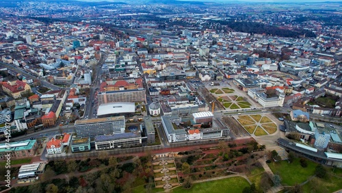 Aerial around the downtown of the city Kassel in Hessen, Germany on a cloudy day in early spring. 