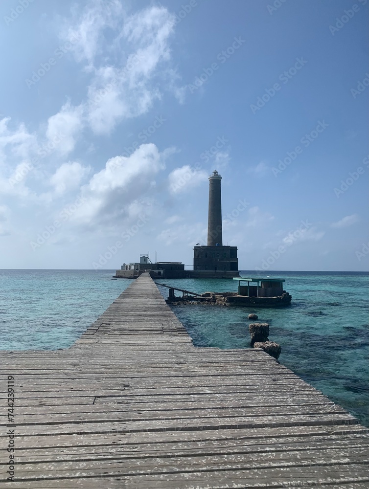 Scenic view of a pier on a turquoise sea on a sunny day