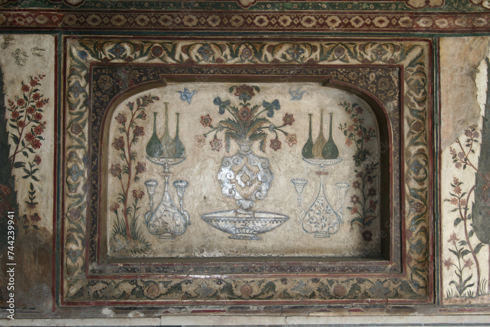 Agra, Uttar Pradesh / India - February 27, 2012 : An inlaid work of color stone on white marble at Itimad-Ud-Daulah in Agra. Agra, Uttar Pradesh / India - February 27, 2012 : An inlaid work of color stone on white marble at Itimad-Ud-Daulah in Agra.