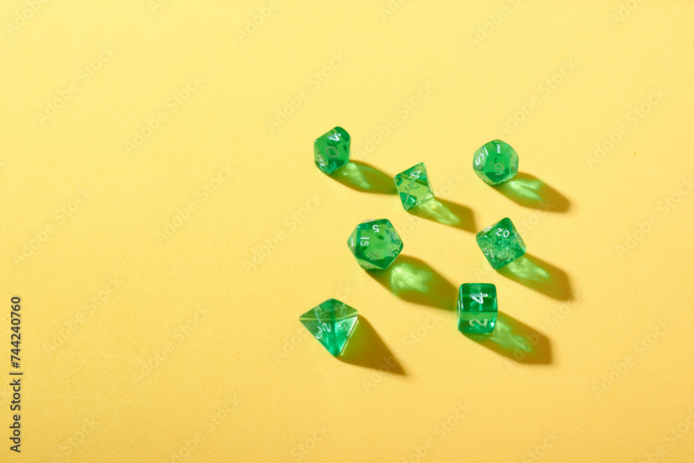 Green Dice on Yellow Background: Colorful Gaming Scene Green Dice on Yellow Background: Colorful Gaming Scene