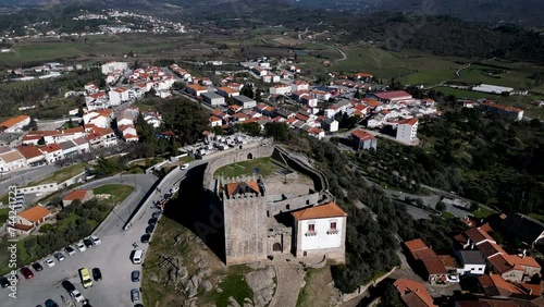 Historic Belmonte Castle Overlooking Portuguese Village - aerial overhead reveal photo