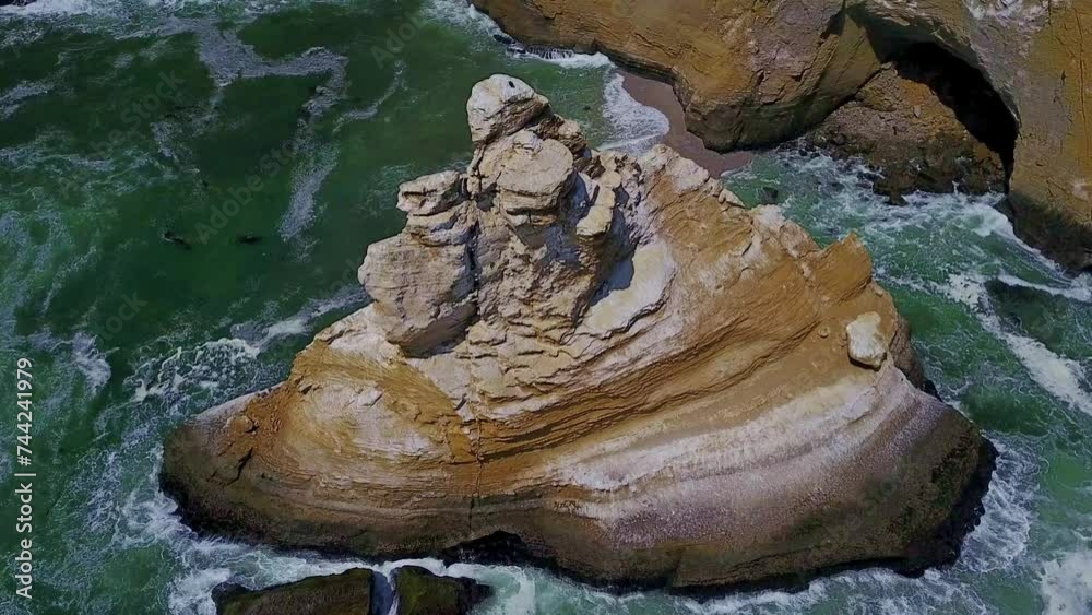 Top Down View with Slow Tilt Up Over La Catedral Rock Along the Coastal Cliffs of Peru, South America. Top Down View with Slow Tilt Up Over La Catedral Rock Along the Coastal Cliffs of Peru, South America.