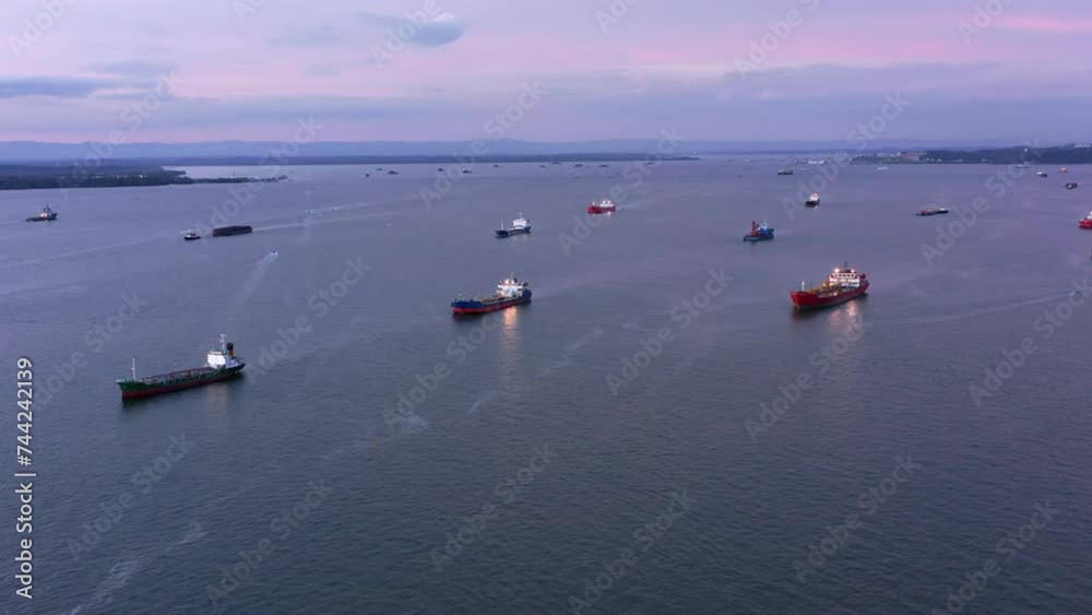 Coast full of Oil and LPG Tankers in the evening - Aerial shot - Port of Balikpapan city - Indonesia Coast full of Oil and LPG Tankers in the evening - Aerial shot - Port of Balikpapan city - Indonesia