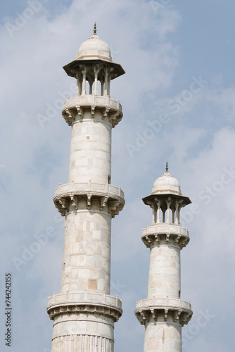 Agra, Uttar Pradesh / India - February 8, 2012 : A close ivew of the two minarets of the southern entrance gate of the Akbar's tomb or the Sikarndra fort. photo