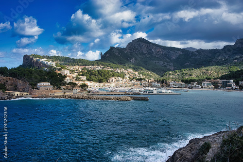 Coastal Charm: Port de Soller Embraced by Lush Mountains and Azure Seas