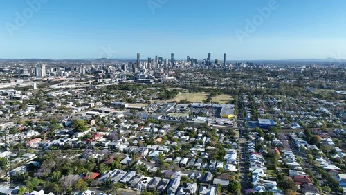 Establishing drone shot of Brisbane City, Newmarket Shopping Village, Grange and Lutwyche. Shot from above Eildon Hill Reservoir, Pull away shot flying away from city. Brisbane Queensland Tourism. photo