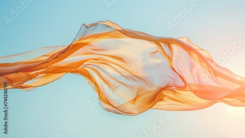 Orange fabric flowing in the breeze