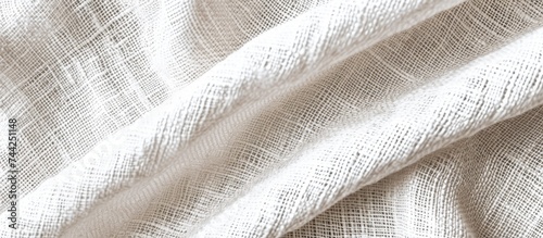 This close-up photo showcases a white fabric texture with light linen fibers, creating a soft and smooth surface.