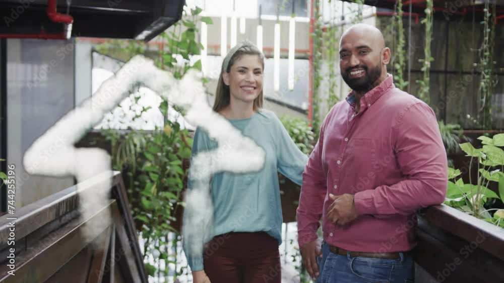 Animation of cloud house icon over happy diverse couple on balcony Animation of cloud house icon over happy diverse couple on balcony