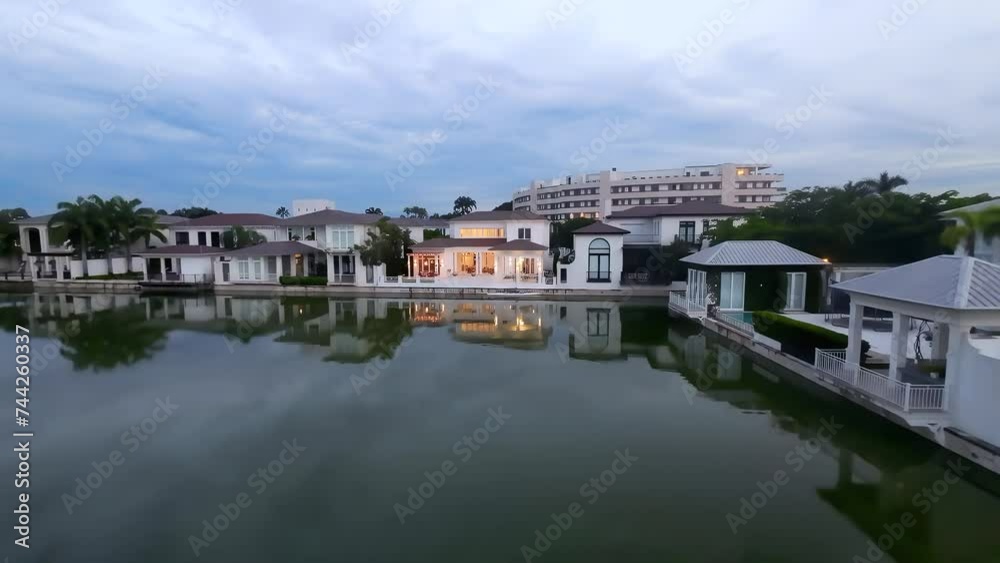Elegant Villas In Prestigious Lagos de Batan At Sunset In Samborondon, Guayaquil, Ecuador. drone shot Elegant Villas In Prestigious Lagos de Batan At Sunset In Samborondon, Guayaquil, Ecuador. drone shot