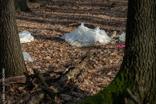 Discarded garbage bag in the forest.