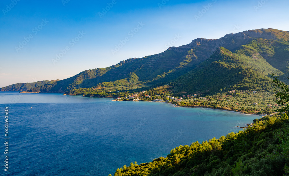 Scenic view from hilltop: mountains and blue waters in Thassos, Greece