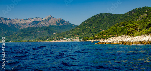 Picturesque lake with distant mountains in Thassos, Greece