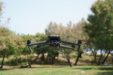 High-tech drone with large sensors and multifunctional camera, with powerful zoom and thermal, for rescue and surveillance, flying in the field