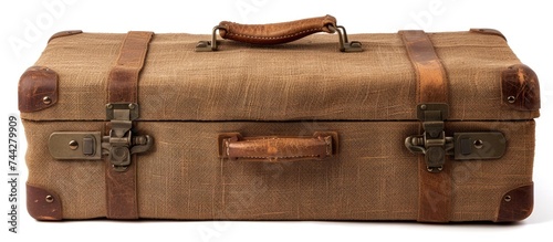 A cut-out wood burlap suitcase with a brown exterior, featuring two brown straps and a sturdy handle, isolated on a white background.