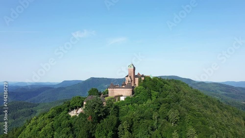 The panoramic view of the city of Cargese in the middle of the arid and green mountains, in Europe, in France, in Corsica, towards Ajaccio, by the Mediterranean Sea, in summer, on a sunny day. photo