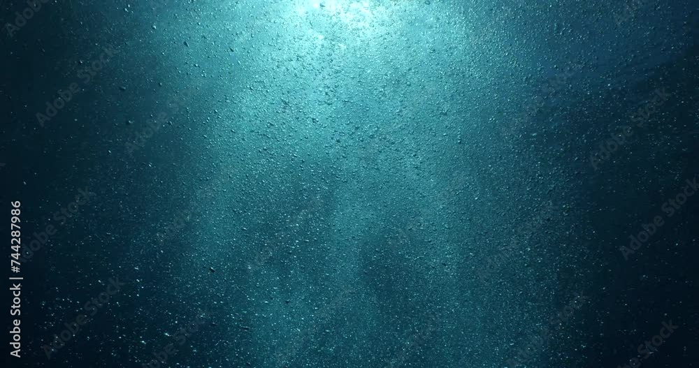 air bubbles slow  underwater coming up scenery dark blue and sun shine ocean scenery from scuba  divers backgrounds
