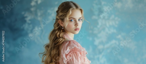 Portrait of a beautiful young girl with long flowing hair and captivating blue eyes