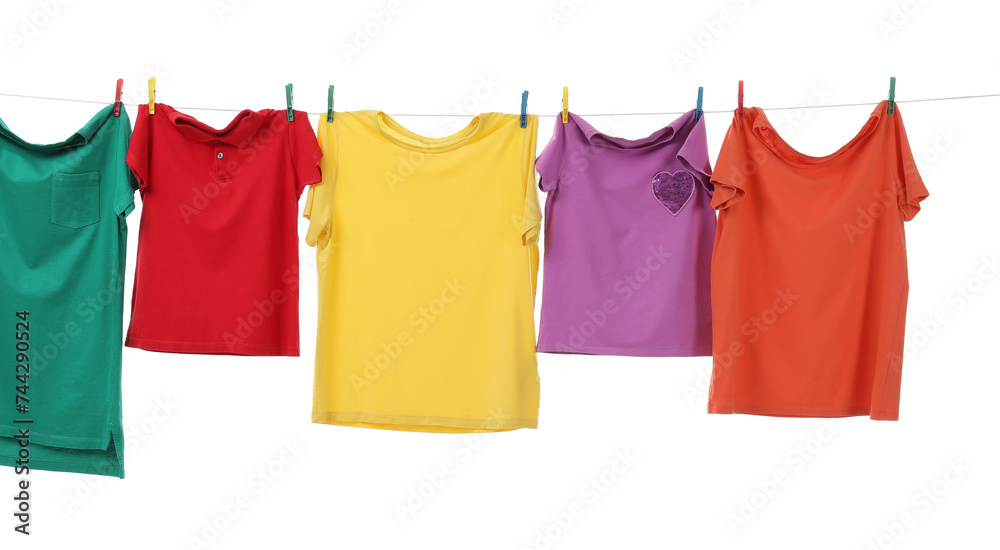 Colorful t-shirts drying on washing line isolated on white