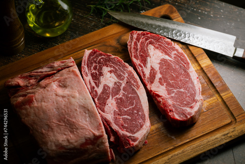 chunk of ribeye steak on wooden board