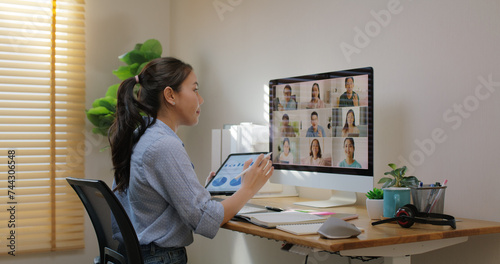 Happy smile asia young talent woman learn mba college class on webcam video call in desktop screen with cowork friend workforce group talk in sale report. Smart job work at home for staff workspace.