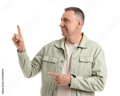 Mature man pointing at some...